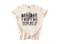 Just a Mama Out Here Trying Not to Raise A-Holes Graphic Tee